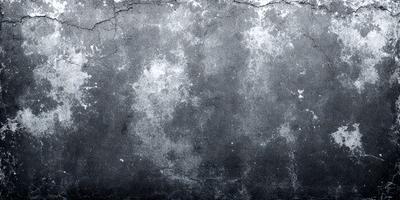 The primary subject of the image is a gray, textured wall with a pattern of white dots. The setting is a room with a gray background. The visual style is a combination of a photo and digital art, creating a unique and intriguing appearance. The dominant colors are gray and white, with the white dots adding a touch of contrast and interest to the overall atmosphere.