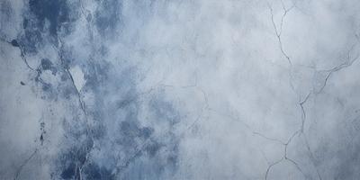 The primary subject of the image is a blue and white wall with a cracked texture. The setting is a room with a blue and white color scheme. The visual style is a close-up of the wall, showcasing its unique texture. The colors and mood of the image are predominantly blue and white, creating a calm and serene atmosphere.