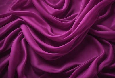 The primary subject of the image is a purple fabric, which is the main object, scene, or focus of the image. The setting or background consists of a purple sheet, and the visual style is a close-up of the purple fabric. The colors and mood of the image are predominantly purple, creating a calm and serene atmosphere.