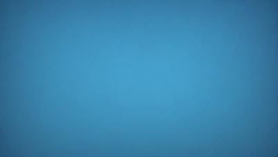 The primary subject of the image is a clear blue sky. The setting is a vast, open space with no visible landmarks or objects. The visual style is a natural, untouched landscape. The colors and mood are serene and peaceful, with the blue sky creating a calm and tranquil atmosphere.