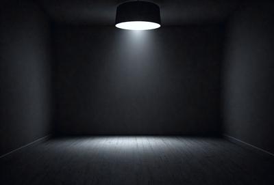 The primary subject of the image is a large, bright light shining in a dark room. The setting is a bare, empty room with a wooden floor. The visual style is a black and white photo, giving the image a classic and dramatic feel. The dominant colors are black and white, with the light source being the only source of color. The overall atmosphere is one of mystery and intrigue, as the light illuminates the darkness and creates a striking contrast.
