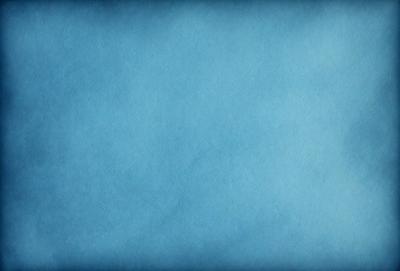 The primary subject of the image is a blue background. The setting is a large, empty space with no visible objects or people. The visual style is a close-up of the blue background, which gives a sense of depth and focus to the image. The colors and mood are predominantly blue, creating a calm and serene atmosphere.