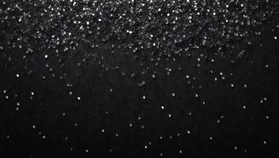 The primary subject of the image is a black background with a pattern of glittering stars. The setting is a dark, starry night, and the visual style is a combination of a photo and digital art. The colors are predominantly black, with the stars being the main source of light and color. The overall atmosphere is one of mystery and wonder, as the viewer is drawn into the starry night scene.