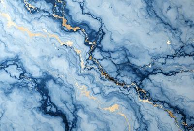 The primary subject of the image is a blue and gold marbled stone. The setting is a blue and gold marbled stone surface, which serves as the background. The visual style is a close-up of the marbled stone, showcasing its intricate patterns and colors. The dominant colors are blue and gold, creating a rich and luxurious atmosphere.