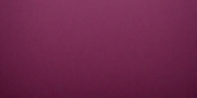 The primary subject of the image is a large, purple wall. The setting is a room with a pink background. The visual style is a close-up of the wall, which gives a sense of depth and texture. The dominant colors are purple and pink, creating a warm and inviting atmosphere.