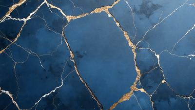 The primary subject of the image is a blue and gold wall with a cracked and chipped appearance. The setting is a room with a blue and gold color scheme. The visual style is a close-up of the wall, showcasing the cracked and chipped surface. The colors and mood of the image are a mix of blue and gold, giving it a unique and artistic appearance.