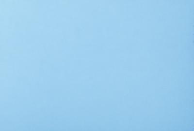 The primary subject of the image is a clear blue sky. The setting is a vast, open space with no visible landmarks or objects. The visual style is a natural, outdoor scene. The colors and mood are predominantly blue, creating a calm and serene atmosphere.