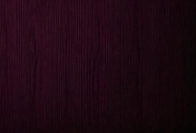Purple wall with wood grain texture.