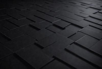 The primary subject of the image is a black and white patterned floor. The setting is a dark room, and the visual style is a close-up of the floor. The colors and mood of the image are predominantly black and white, creating a stark and minimalist atmosphere.
