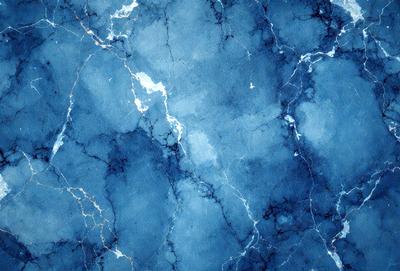 The primary subject of the image is a blue marble wall with a pattern of white spots. The setting is a room with a blue marble floor. The visual style is a digital art, illustration, or drawing. The dominant colors are blue and white, creating a calm and serene atmosphere.