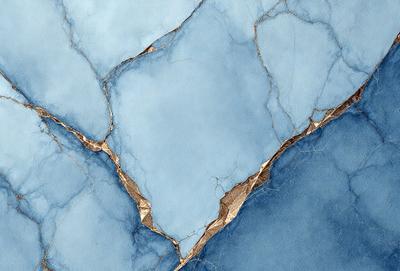 The primary subject of the image is a blue marble wall with a crack in it. The setting is a room with a blue background. The visual style is a close-up of the marble wall, showcasing its texture and color. The dominant colors are blue and gold, creating a calm and serene atmosphere.