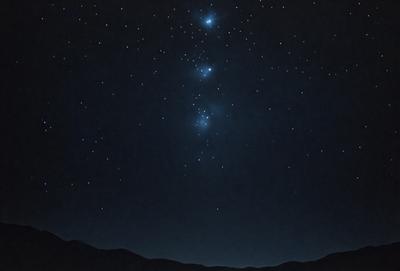 The primary subject of the image is the night sky filled with stars. The setting is a dark, starry night with a mountainous background. The visual style is a black and white photo, which adds a sense of timelessness and elegance to the scene. The colors and mood are predominantly dark and serene, with the stars and mountain range creating a sense of wonder and tranquility.