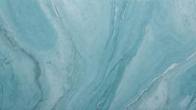 The primary subject of the image is a blue and white marbled tile. The setting is a bathroom, as indicated by the presence of the marbled tile. The visual style is a close-up of the tile, showcasing its intricate design. The dominant colors are blue and white, creating a calm and soothing atmosphere.