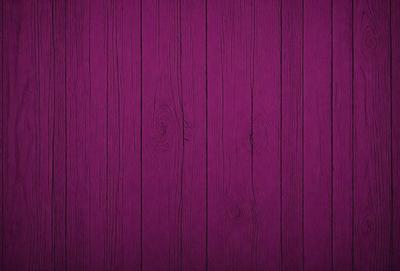 Purple wood paneling on a wall.
