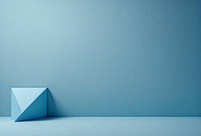 The primary subject of the image is a blue box, which is the main object in the scene. The setting is a blue wall, and the visual style appears to be a photo. The dominant colors in the image are blue and white, creating a calm and serene atmosphere.