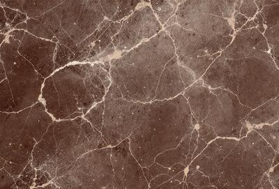 The primary subject of the image is a close-up of a marble wall with a brown and white color scheme. The setting is a room with a brown and white marble wall, which serves as the background. The visual style is a close-up of the marble wall, showcasing its texture and details. The colors and mood of the image are warm and earthy, with the brown and white marble creating a natural and elegant atmosphere.