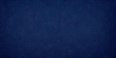 The primary subject of the image is a blue background. The setting is a dark blue sky, and the visual style is a photo. The colors and mood of the image are predominantly dark and moody, with the blue background creating a sense of depth and calmness.