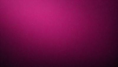 The primary subject of the image is a large, pink wall. The setting is a room with a pink background, and the visual style is a close-up of the wall. The dominant colors in the image are pink, and the overall atmosphere is warm and inviting.