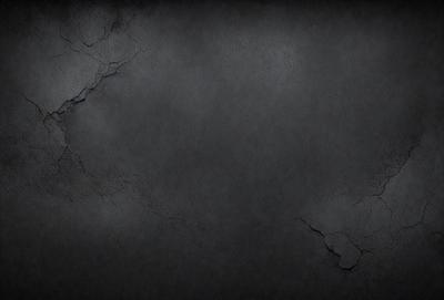The primary subject of the image is a black and white photo of a wall with a cracked surface. The setting is a dark room, and the visual style is a close-up of the wall. The colors and mood of the image are dark and moody, with the black and white color scheme adding to the atmosphere.