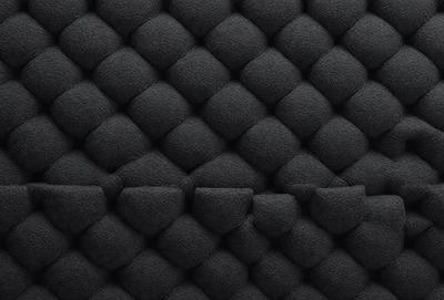 The primary subject of the image is a black and white patterned wallpaper. The setting is a black background, which emphasizes the patterned wallpaper. The visual style is a close-up of the wallpaper, showcasing its intricate design. The colors and mood of the image are predominantly black and white, giving it a classic and timeless appearance.