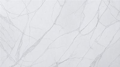 The primary subject of the image is a white marble wall with a pattern of white and grey veins. The setting is a room with a white background, and the visual style is a close-up of the marble wall. The colors and mood of the image are predominantly white and grey, giving it a clean and elegant appearance.