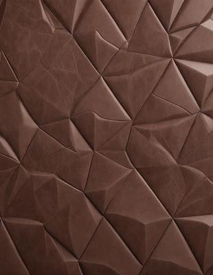 The primary subject of the image is a brown leather material, which appears to be a piece of leather or a leather-like fabric. The setting is a close-up of the leather material, showcasing its texture and pattern. The visual style is a close-up of the leather material, which gives it a realistic and textured appearance. The colors and mood of the image are predominantly brown, giving it a warm and natural feel.