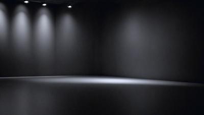 The primary subject of the image is a large, dark room with a white floor. The setting is a black room with a white floor, and the visual style is a photo. The room appears to be empty and has a somewhat eerie atmosphere due to the darkness and the lack of any other objects or people.