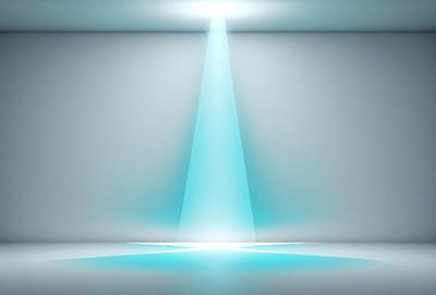 The primary subject of the image is a bright blue light shining on a white wall. The light appears to be coming from a spotlight, creating a striking visual effect. The setting is a white room with a plain wall, providing a clean and minimalistic backdrop for the light. The visual style of the image is a combination of digital art and photography, as the light source is clearly visible and the overall atmosphere is bright and vibrant.