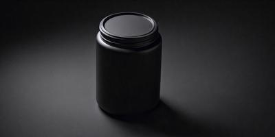 The primary subject of the image is a black jar or canister, which is placed on a dark grey surface. The jar appears to be made of metal, and it is the main focus of the image. The setting or background consists of a dark grey surface, which provides a contrasting backdrop for the jar. The visual style of the image is a close-up of the jar, showcasing its details and texture. The colors and mood of the image are predominantly dark, with the black jar and grey surface creating a sense of depth and contrast.