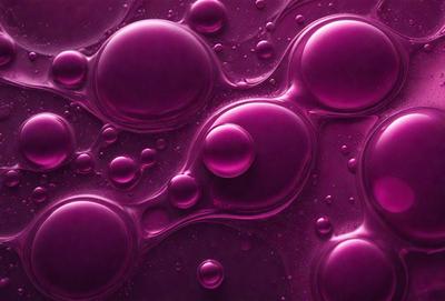 The primary subject of the image is a close-up of a purple liquid, possibly a sauce or a drink, with a few bubbles in it. The setting is a dark background, which contrasts with the purple liquid. The visual style appears to be a close-up of a purple liquid, possibly a sauce or a drink, with a few bubbles in it. The colors and mood of the image are predominantly purple, creating a visually striking and moody atmosphere.