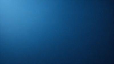 The primary subject of the image is a blue sky with no clouds. The setting is a clear, cloudless day. The visual style is a natural, outdoor scene. The colors and mood are calm, serene, and peaceful.