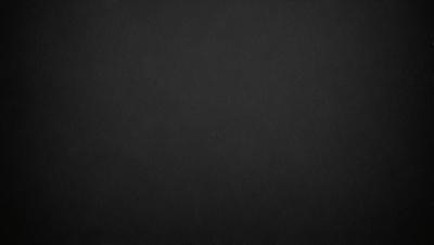 The primary subject of the image is a black background. The setting is a dark, empty space with no visible objects or elements. The visual style is a simple, monochromatic design. The colors and mood are predominantly dark and moody, creating a sense of mystery or drama.