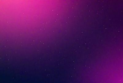 The primary subject of the image is a night sky filled with stars. The setting is a dark, star-filled sky, and the visual style is a photo. The colors and mood of the image are predominantly dark and moody, with the stars being the main source of light in the scene.