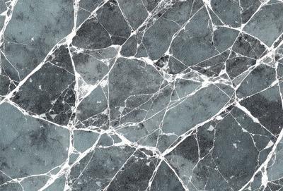 The primary subject of the image is a close-up of a marble tile with a blue and white pattern. The setting is a bathroom, as indicated by the presence of the marble tile. The visual style is a photo, showcasing the intricate details of the tile. The dominant colors are blue and white, creating a clean and elegant atmosphere.
