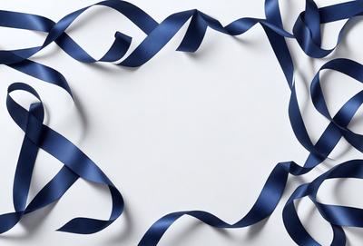 The primary subject of the image is a blue ribbon or bow, which is the main object, scene, or focus of the image. The ribbon is wound around a white surface, creating a visually striking contrast between the blue and white colors. The setting or background of the image is a white wall, which provides a clean and uncluttered backdrop for the blue ribbon. The visual style of the image is a close-up of the blue ribbon, showcasing its intricate details and texture. The overall atmosphere of the image is elegant and sophisticated, with the blue ribbon symbolizing a sense of celebration or achievement.
