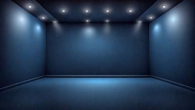 The primary subject of the image is a large, empty room with a blue wall. The setting is a dark room with a blue wall, and the visual style is a photo. The room appears to be a large, empty space with a blue color scheme, creating a calm and serene atmosphere.