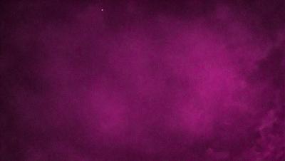 The primary subject of the image is a purple background, which appears to be a foggy or smoky environment. The setting is a dark, cloudy sky, and the visual style is a close-up of the purple background. The colors and mood of the image are predominantly purple, creating a moody and atmospheric scene.