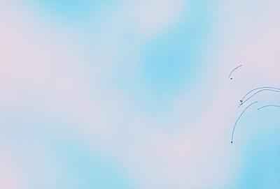 The primary subject of the image is a kite flying in the sky. The kite is positioned in the upper right corner of the image. The setting is a cloudy blue sky, which serves as the backdrop for the kite. The visual style of the image is a combination of photo and digital art, creating a unique and artistic representation of the kite in flight. The colors and mood of the image are predominantly blue, with a hint of pink, giving it a serene and calming atmosphere.