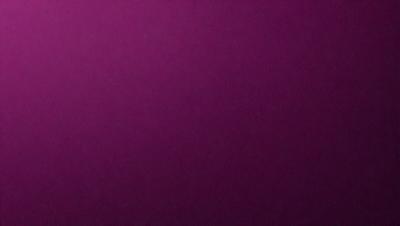 The primary subject of the image is a purple wall. The setting is a room with a purple wall, and the visual style is a close-up of the wall. The colors and mood of the image are predominantly purple, creating a calm and serene atmosphere.