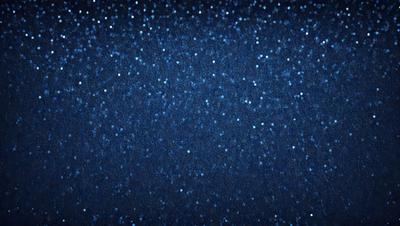 The primary subject of the image is a blue sky filled with bright, twinkling stars. The setting is a nighttime sky, and the visual style is a photo. The colors and mood of the image are predominantly blue and serene, with the stars adding a sense of wonder and tranquility to the scene.