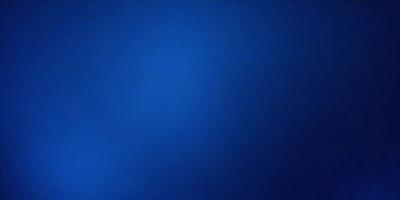 The primary subject of the image is a blue sky with no clouds. The setting is a clear blue sky, and the visual style is a photo. The colors and mood of the image are predominantly blue, creating a calm and serene atmosphere.