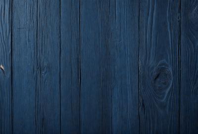The primary subject of the image is a wooden surface, possibly a wall or a table, with a blue color. The setting is indoors, and the visual style appears to be a photo. The dominant colors are blue and brown, creating a calm and soothing atmosphere.