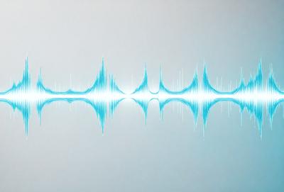 The primary subject of the image is a blue wave or sound wave, which is the main focus of the image. The setting is a white background, which provides a clean and minimalistic environment for the wave. The visual style is a digital art or illustration, as the wave is depicted in a stylized manner. The dominant colors are blue and white, creating a calm and soothing atmosphere.