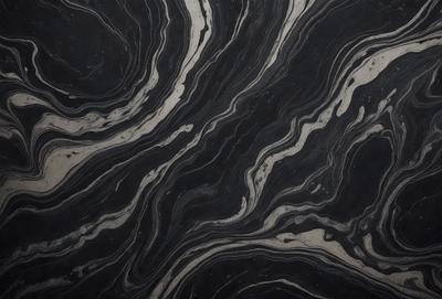 The primary subject of the image is a black and white patterned surface, which appears to be a marble or stone texture. The setting is a dark background, which contrasts with the patterned surface. The visual style is a close-up of the pattern, showcasing the intricate details of the design. The colors and mood of the image are predominantly dark, with the black and white pattern creating a sense of depth and complexity.