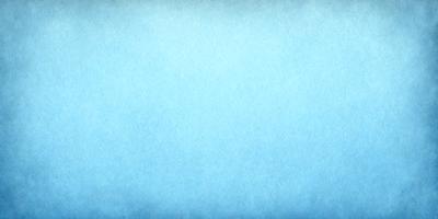 The primary subject of the image is a large, blue, textured surface. The setting is a blue sky, and the visual style is a photo. The colors and mood of the image are predominantly blue, creating a calm and serene atmosphere.