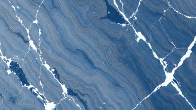 The primary subject of the image is a blue and white marbled stone wall. The setting is a rocky surface, and the visual style is a close-up of the stone wall. The colors and mood of the image are predominantly blue and white, creating a calm and serene atmosphere.