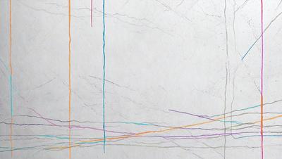 The primary subject of the image is a white paper with a variety of colored lines drawn on it. The setting is a white background, and the visual style appears to be a combination of a photo and a drawing. The colors and mood of the image are vibrant and lively, with the colored lines creating a sense of movement and energy.