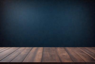 The primary subject of the image is a wooden table with a blue wall in the background. The table appears to be a wooden countertop, and the blue wall adds a contrasting color to the scene. The visual style of the image is a photo, capturing the wooden table and the blue wall in a realistic manner. The colors and mood of the image are predominantly blue, creating a calm and serene atmosphere.