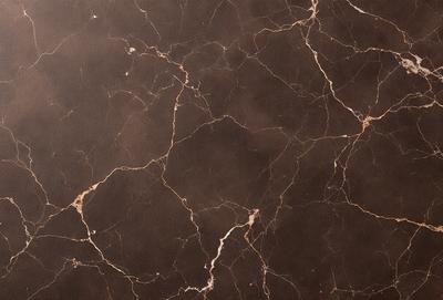 The image features a close-up of a marble surface with a black background. The marble surface has a pattern of white and brown spots, giving it a unique and natural appearance. The overall atmosphere of the image is elegant and sophisticated, as the marble surface is the primary subject and the black background provides a contrasting backdrop.