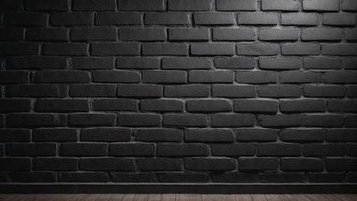 The primary subject of the image is a large brick wall. The setting is a dark room with a brick wall as the main focus. The visual style is a black and white photo, giving the image a classic and timeless appearance. The dominant colors are black and white, creating a moody and dramatic atmosphere.